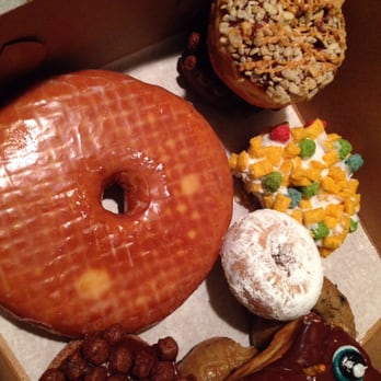 Voodoo Doughnut - Big a$$ doughnut, captain crunch, rice crispy powders sugar, Cocoa Puffs and chocolate voodoo doll - Donuts Near Me - Austin, Texas Voodoo Doughnut - Big a$$ doughnut, captain crunch, rice crispy powders sugar, Cocoa Puffs and chocolate voodoo doll - Donuts Near Me - Austin, Texas