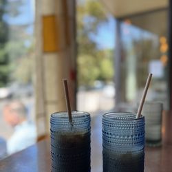 Coquine Market - Iced chai and seasonal (orange blossom caramel) latte