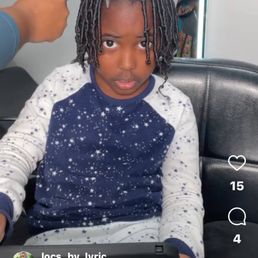 Kiddo getting hair re-twisted. Kiddo getting hair re-twisted.