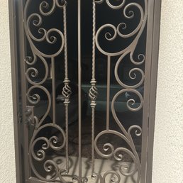 This is a photo of a useless front door gate that doesn't close. This is a photo of a useless front door gate that doesn't close.