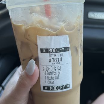 Dunkin' - a hand holding a cup of iced coffee - Donuts Near Me - Arcadia, Florida Dunkin' - a hand holding a cup of iced coffee - Donuts Near Me - Arcadia, Florida