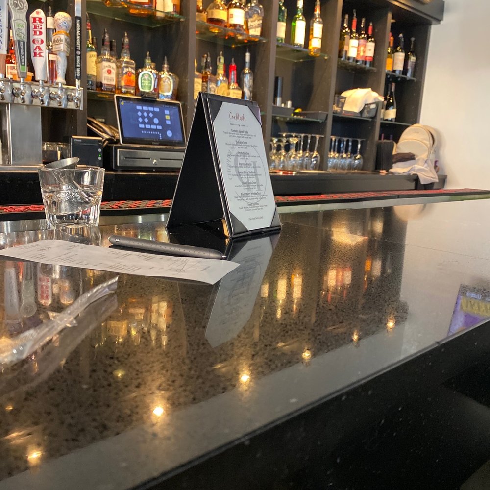 Chophouse 101 - a bar with a menu on the counter - American Near Me - Kannapolis, North Carolina Chophouse 101 - a bar with a menu on the counter - American Near Me - Kannapolis, North Carolina