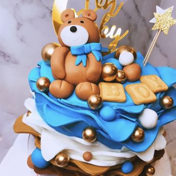 Sugar on Top Dessert Studio - a teddy bear on top of a cake - Desserts Near Me Sugar on Top Dessert Studio - a teddy bear on top of a cake - Desserts Near Me