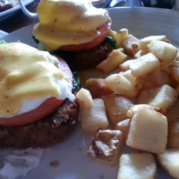 Indigo Crow - Crab cake eggs benedict  (with some added tomatoes and spinach ) - American Near Me - Corrales, New Mexico