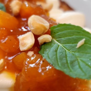 TOAST Cafe - Close-up of Apricot jam and ricotta cheese toast with mint leaf - Cafes Near Me - San Diego, California TOAST Cafe - Close-up of Apricot jam and ricotta cheese toast with mint leaf - Cafes Near Me - San Diego, California