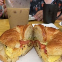 Neighborhood Joe - Egg sandwich on a croissant add bacon with a lavender iced latte