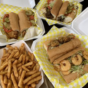 The Poboy Company - Catfish Poboy, roast beef Poboy, 1/2 shrimp & 1/2 oyster, portion of fries. - Seafood Near Me - Mandeville, Louisiana The Poboy Company - Catfish Poboy, roast beef Poboy, 1/2 shrimp & 1/2 oyster, portion of fries. - Seafood Near Me - Mandeville, Louisiana