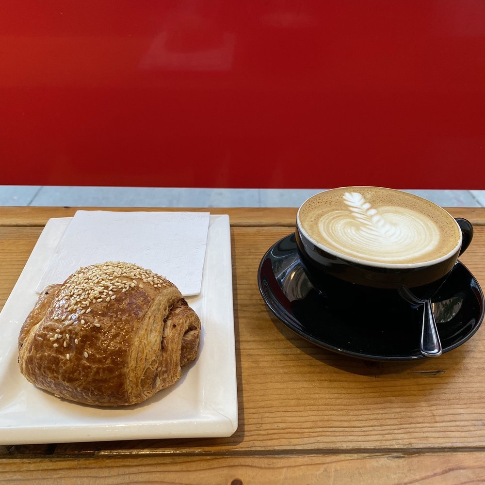 a cup of coffee and a croissant a cup of coffee and a croissant