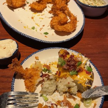 Red Lobster - Parrot Isle Jumbo Coconut Shrimp with pina colada sauce, coleslaw and loaded baked potato. - Seafood Near Me - Reno, Nevada Red Lobster - Parrot Isle Jumbo Coconut Shrimp with pina colada sauce, coleslaw and loaded baked potato. - Seafood Near Me - Reno, Nevada