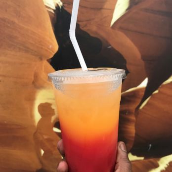 Unforgettable Lemonade - hand holding a drink - Juice Bars & Smoothies Near Me Unforgettable Lemonade - hand holding a drink - Juice Bars & Smoothies Near Me