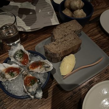 Rich Table - Left to right, bottom to top: Oysters, Bread & Butter, Dried Porcini Doughnuts - New American Near Me - San Francisco, California