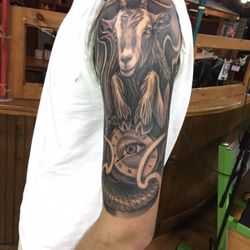 Eminence Ink - The sea-goat represents the Capricorn zodiac. The pocket-watch has the time I was born. My mother's eye: her guidance and protection.