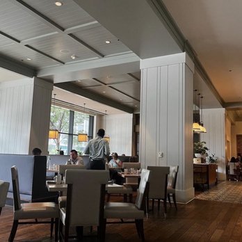 Kitchen Notes - a dining area with a bar and tables - Southern Near Me - Nashville, Tennessee