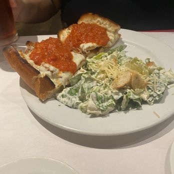 Tony And Luigis - 1/2 chicken Parmesan sandwiches with Caesar salad - Italian Near Me - Georgetown, Texas Tony And Luigis - 1/2 chicken Parmesan sandwiches with Caesar salad - Italian Near Me - Georgetown, Texas
