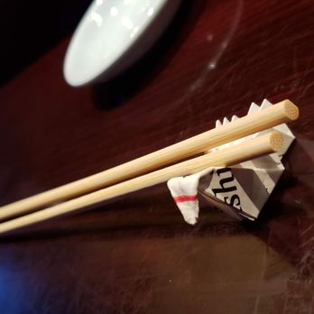 Daikichi Sushi Bistro - Folding a swan from my chopstick wrapper to make a chopstick rest - Japanese Near Me - Chesapeake, Virginia Daikichi Sushi Bistro - Folding a swan from my chopstick wrapper to make a chopstick rest - Japanese Near Me - Chesapeake, Virginia