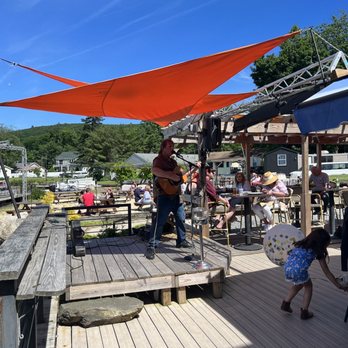 Cove Castle - a man playing a guitar on a deck - Venues & Event Spaces Near Me - Greenwood Lake, New York Cove Castle - a man playing a guitar on a deck - Venues & Event Spaces Near Me - Greenwood Lake, New York