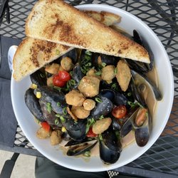 Scotties Bistro - Down on the Bayou PEI Mussels with Shrimp, Andouille sausage and fried okra with Cajun gravy and toast!! Huge portions and phenomenal flavor