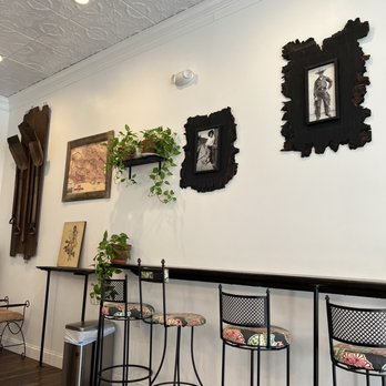 Fogwood & Fig - a bar with stools and pictures on the wall - Vegetarian Near Me - Port Jervis, New York
