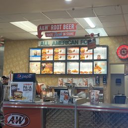 a man standing in front of the counter a man standing in front of the counter