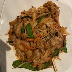 Spicy drunken noodles with shrimp Thai hot.