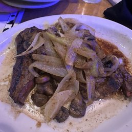 Ft. Worth Ribeye cooked medium with sautéed onions and mushrooms