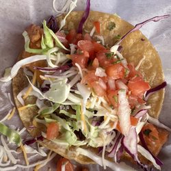 Mauricio's - Mahi mahi tacos. Very messy. Very good