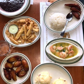 La Carreta - A side of Sweet plantains; yuca fries; and bean soup. On right: Gambas al Ajillo and a side of mashed potatoes. All delish and so filling. - Cuban Near Me - Miami, Florida La Carreta - A side of Sweet plantains; yuca fries; and bean soup. On right: Gambas al Ajillo and a side of mashed potatoes. All delish and so filling. - Cuban Near Me - Miami, Florida