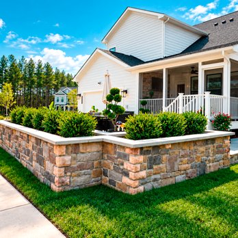 Homeland Contractors - Stone retaining wall planter with boxwood hedges & lush lawn - hardscape & landscape design in Ashburn, McLean, Great Falls & Northern VA - Landscaping Near Me - Ashburn, Virginia Homeland Contractors - Stone retaining wall planter with boxwood hedges & lush lawn - hardscape & landscape design in Ashburn, McLean, Great Falls & Northern VA - Landscaping Near Me - Ashburn, Virginia