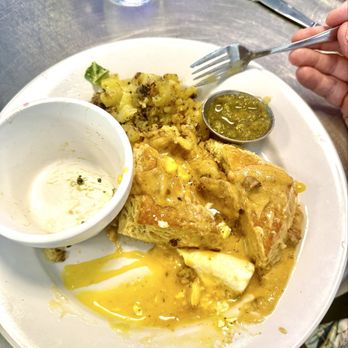Smothered - Too slow with the camera as my husband started eating. Was an egg, kale salad, biscuits and gravy, potatoes and green chile. - Breakfast & Brunch Near Me - Albuquerque, New Mexico