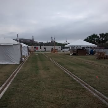 Kiley Garden - Tents for Gasparilla Music Fest. Henry Plant Museum \Hotel Tampa \ Univerdity of Tampa in distance across Hillsborough River - Landmarks & Historical Buildings Near Me - Tampa, Florida