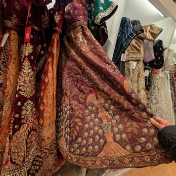 Mohini - Traditional Indian dresses - Collection of traditional Indian dresses featuring detailed embroidery, rich fabrics, and vibrant colors, displayed in a retail store. - Women's Clothing Near Me - Dulles, Virginia