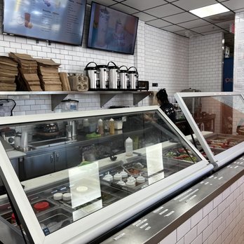 Poke & More - a counter with a variety of food items - Hawaiian Near Me - North Miami, Florida