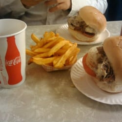 Lou's Sandwich Shop - Two cheesesteak zeps with a side of fries.