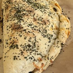 Miner Bill's Pizza Delivery - The "Golden Rule Bierock" - ALL veggies and meats, home-made pizza sauce, mozzarella cheese folded over in our home-dough and baked.