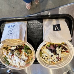 two plates of food on a tray two plates of food on a tray