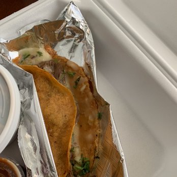 Estilo Casero - a taco and sauce on a tray - Mexican Near Me - Orlando, Florida