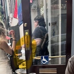 This photo shows the same server delivering fresh cloth napkins, which confirms that the restaurant had cloth napkins available at the time.