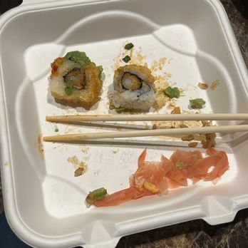 Trapper's Sushi - To go box and a Buddahlisous next to a Trapper Roll. Very small. - Sushi Bars Near Me - Puyallup, Washington Trapper's Sushi - To go box and a Buddahlisous next to a Trapper Roll. Very small. - Sushi Bars Near Me - Puyallup, Washington