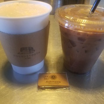 Houndstooth Coffee - Chai tea latte on left and iced chocolate latte on right. We also ordered a small chocolate piece. - Coffee & Tea Near Me - Dallas, Texas