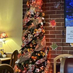 Johnny's Family Restaurant - Has a fireplace with Halloween tree so pretty
