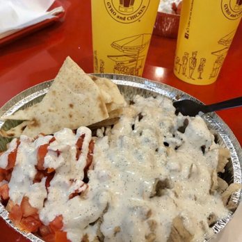 The Halal Guys - Combo platter chicken and gyro with lettuce, tomato, rice, and white sauce.  Delicious!! - Halal Near Me - Glendale, California