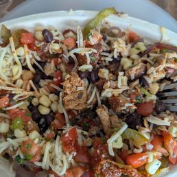 Less than a dozen cubes of chicken in my bowl it is all rice beans and veggies. Less than a dozen cubes of chicken in my bowl it is all rice beans and veggies.