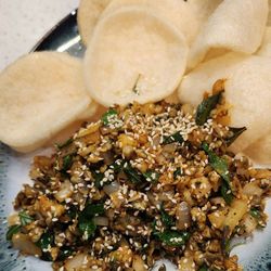 Phở Ru Restaurant - Wok tossed clams with house-made shrimp chips