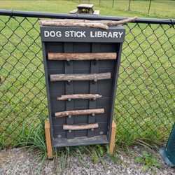 Forest Ridge Cabins and Campgrounds - Dog Stick Library at the dog park entrance.