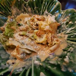 Remainder of my wedge salad with the dressing absolutely drowning out the bottom portion of the salad Remainder of my wedge salad with the dressing absolutely drowning out the bottom portion of the salad