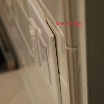 Prestige Kitchen & Bath - Uneven tile causing wall plate to protrude. - General Contractors Near Me - Arlington Heights, Illinois