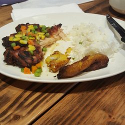 Cafe Y Canela Colombian Restaurant - Chicken in sauce, rice, and plantain.