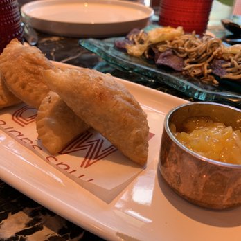 MAD - Empanadillas: suckling pig, potato, onion & mango apricot chutney. - Spanish Near Me - Houston, Texas