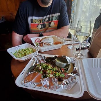 SOPA - a man sitting at a table with a tray of food - Food Trucks Near Me - Bend, Oregon