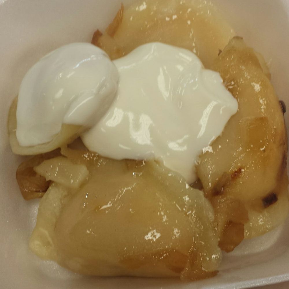 6 cheeese and potato perogies with sour cream on top. So shiny!!!